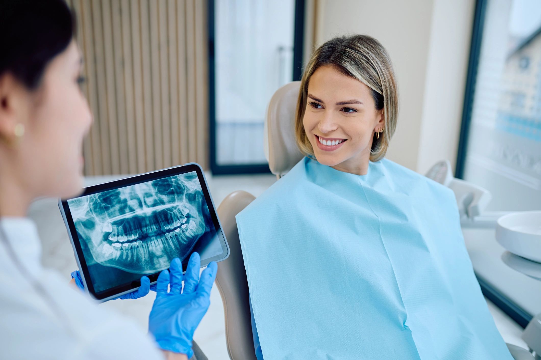 Dentist discussing sleep apnea oral appliance treatment with patient